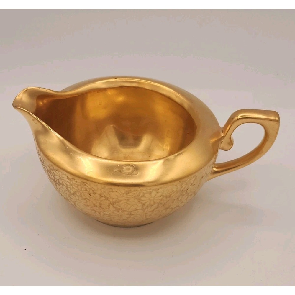 Tirschenreuth Bavaria gold encrusted creamer with floral‎ pattern.